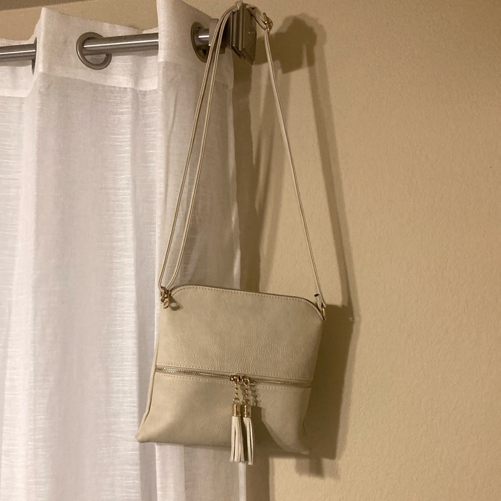 Lightweight Medium Crossbody
Bag with Tassel